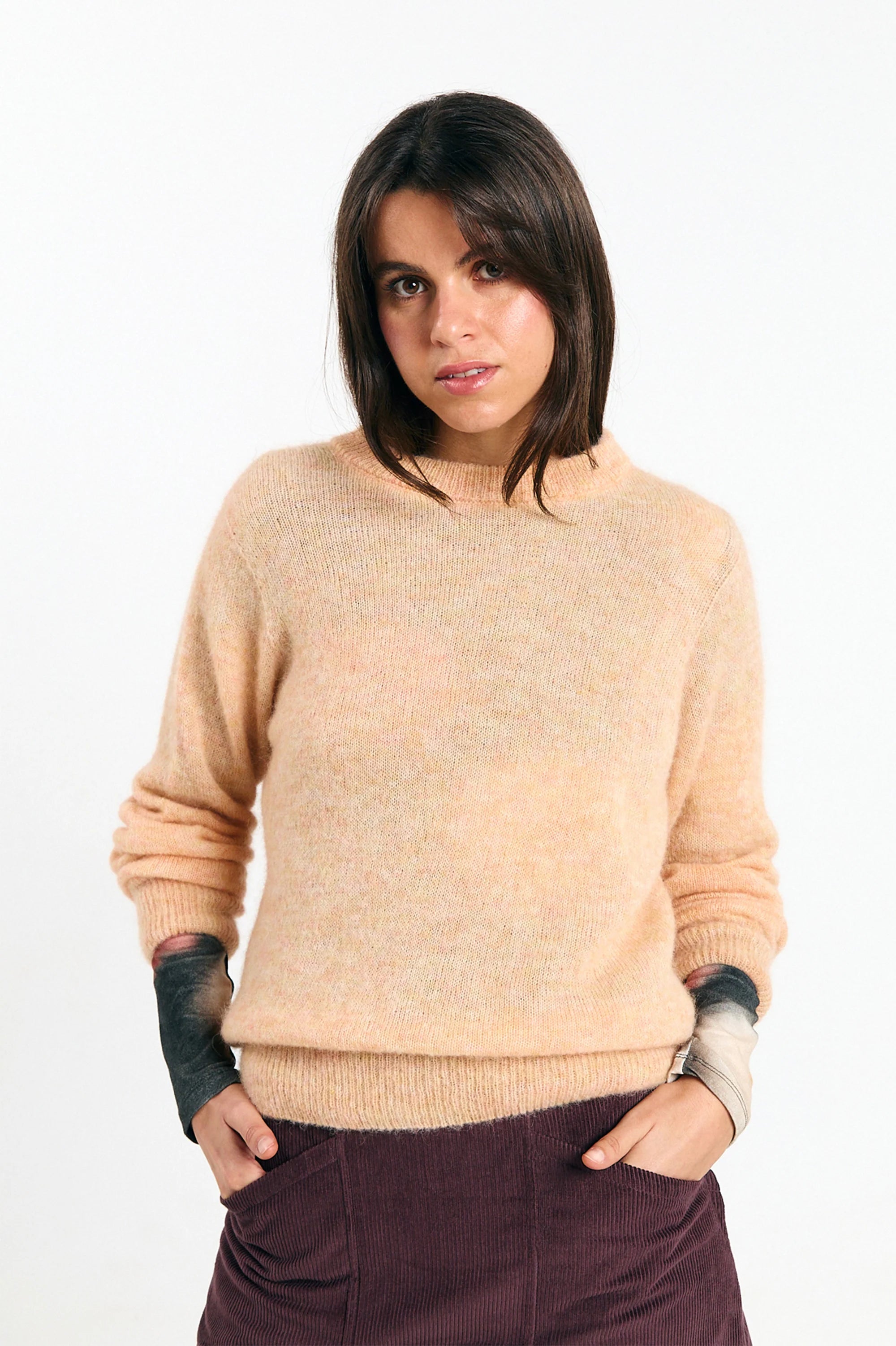 Babol Jumper Peach sweater by SUITE13LAB, featuring a cozy peach-colored knit with a relaxed fit and subtle ribbed details.