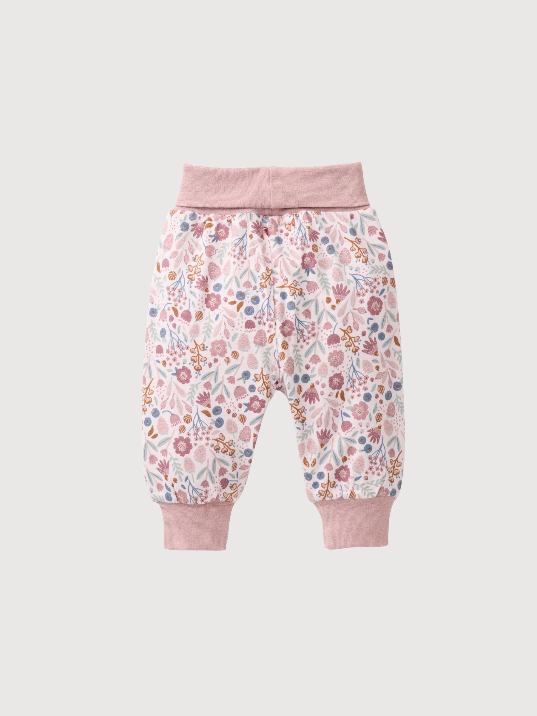 Pink reversible pants with autumn flowers | People Wear Organic