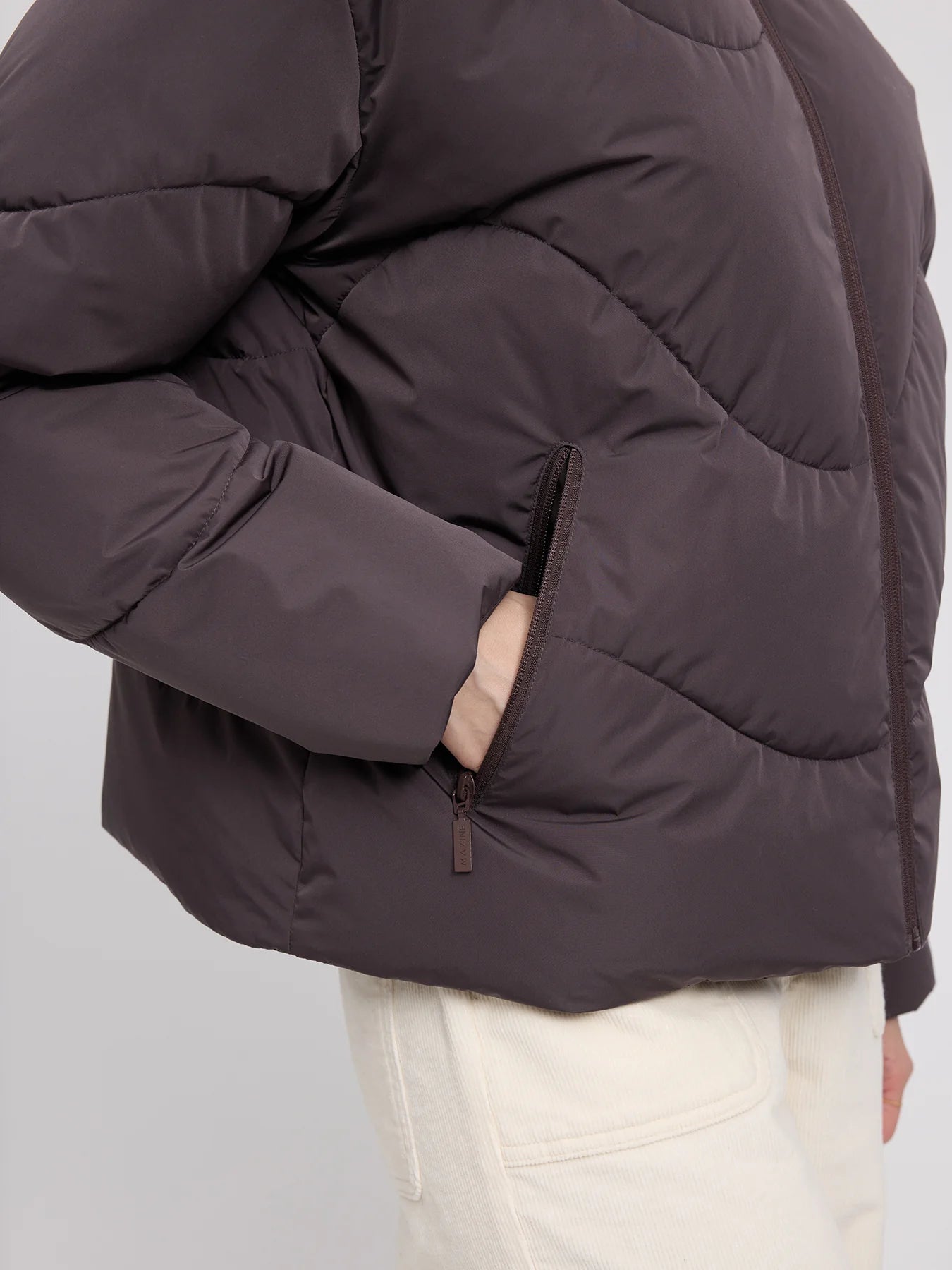 MAZINE Waves Quilt Short Puffer Jacket in eggplant color, showing a lightweight, quilted puffer design with a high collar and slim fit.