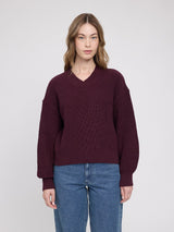 Burgundy chunky knit V-neck pullover by MAZINE, featuring cozy textured knit fabric and a relaxed fit.