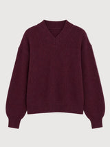 MAZINE burgundy chunky knit V-neck pullover sweater displayed on a hanger, showcasing its cozy textured knit and V-neck design.