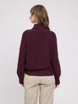 MAZINE burgundy chunky knit pullover with turtle neck, cozy and stylish for cold weather, shown on a model.
