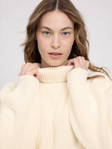MAZINE chunky knit pullover with turtle neck in Tofu color, featuring a cozy, oversized design and textured fabric.