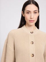 Light beige cotton crew neck cardigan pullover by MAZINE, neatly folded with visible knit texture and ribbed edges.