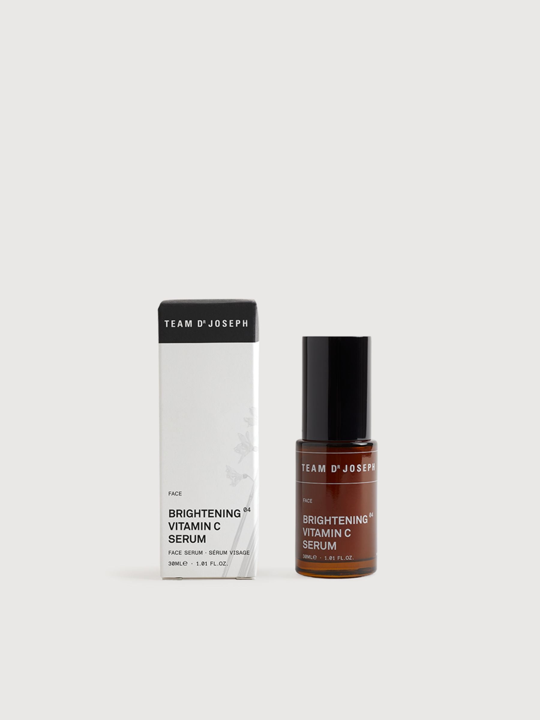 Brightening Vitamin C Serum by TEAM DR JOSEPH in a 30 ml bottle, showing the serum's sleek packaging and clear liquid inside.