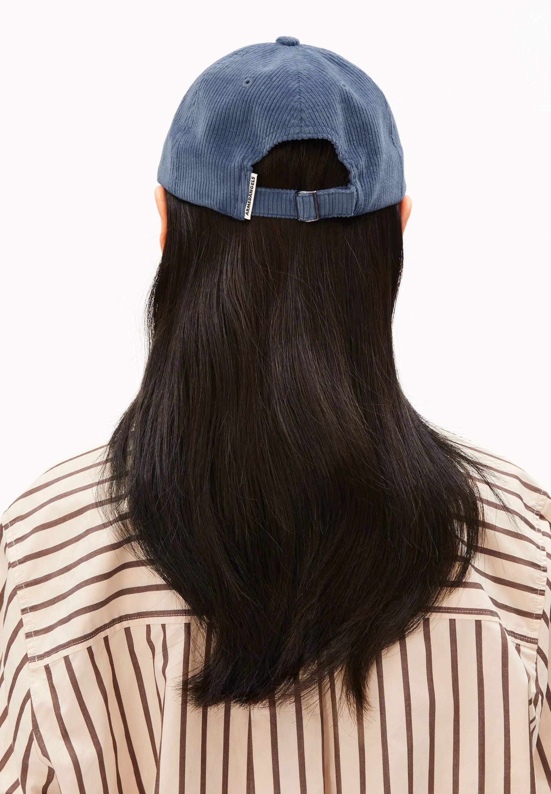Women’s Yenaas Heavy Corduroy Cap in Dusty Moon by ARMEDANGELS, featuring a soft, textured corduroy fabric and classic cap design.