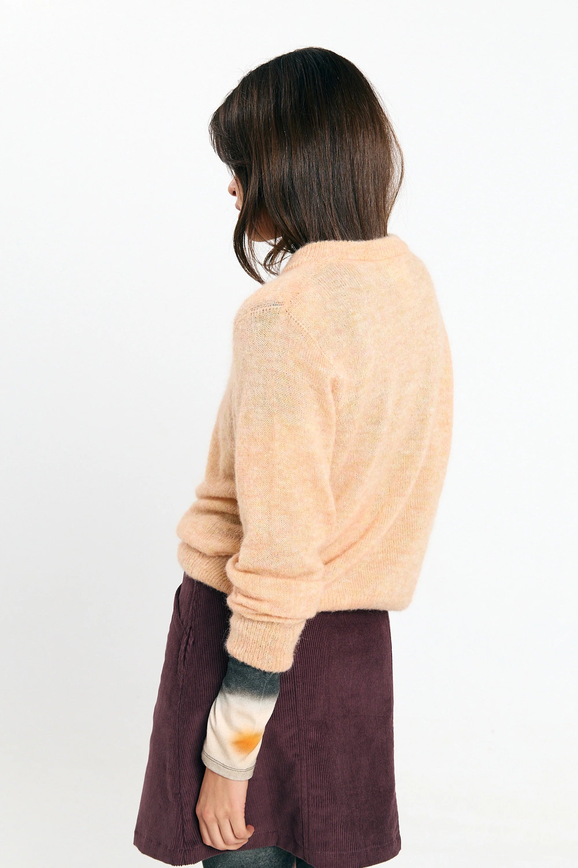 Soft peach Babol jumper sweater by SUITE13LAB, featuring a cozy fit and stylish design, displayed on a neutral background.