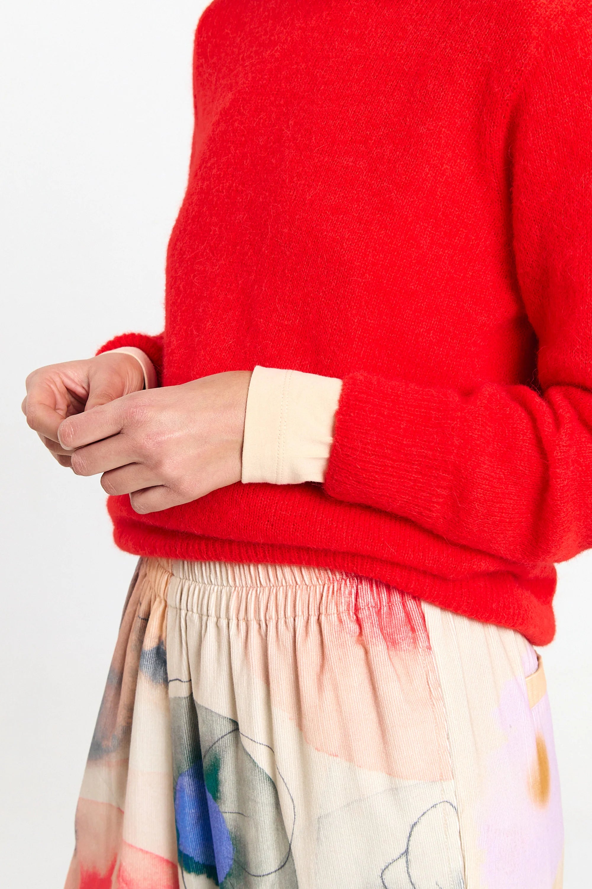 Red Babol Jumper sweater by SUITE13LAB displayed on a mannequin, showing the knit texture and classic fit.