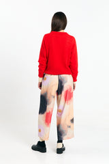Red Babol jumper sweater by SUITE13LAB, featuring a cozy knit design and ribbed cuffs, displayed on a neutral background.