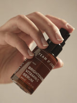 Brightening Vitamin C Serum in a 30 ml bottle by TEAM DR JOSEPH, featuring a clear glass container with a white pump.