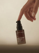 Brightening Vitamin C Serum by TEAM DR JOSEPH in a 30ml bottle, showcasing the clear, amber-colored serum in a sleek dropper bottle.