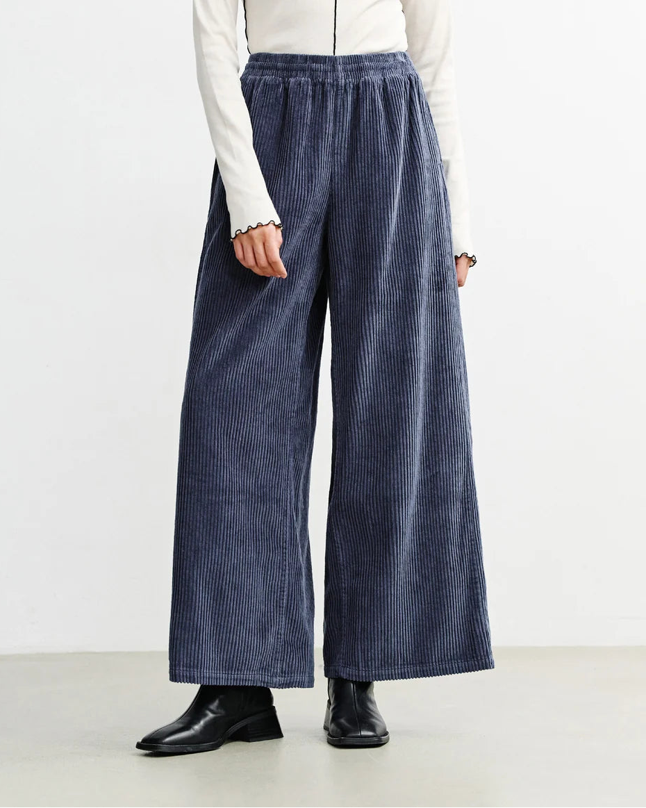 Ash blue corduroy flared trousers for women by Rotholz, showcasing the stylish high-waisted design and flared silhouette.