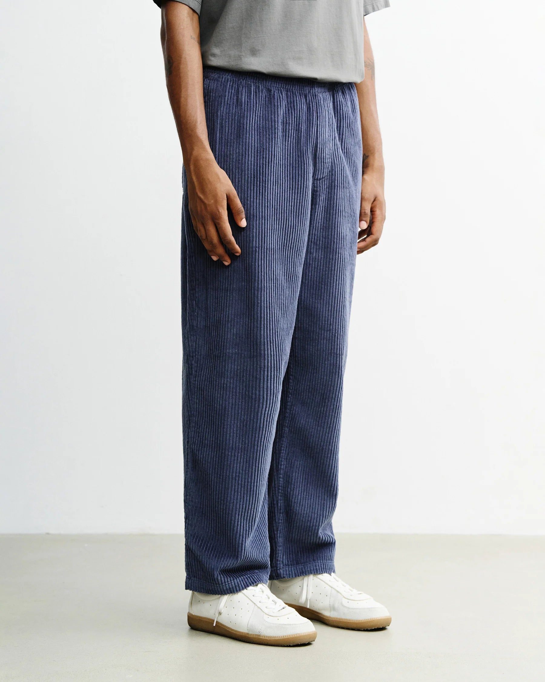 Ash blue wide-leg corduroy trousers by Rotholz, organic cotton men's pants with a relaxed fit and textured fabric.