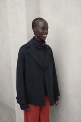 Dana women's charcoal khaki jacket by ECOALF, featuring a stylish, lightweight outdoor design with a zip front and hood.