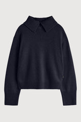 Black sweater with a collar on a light gray background