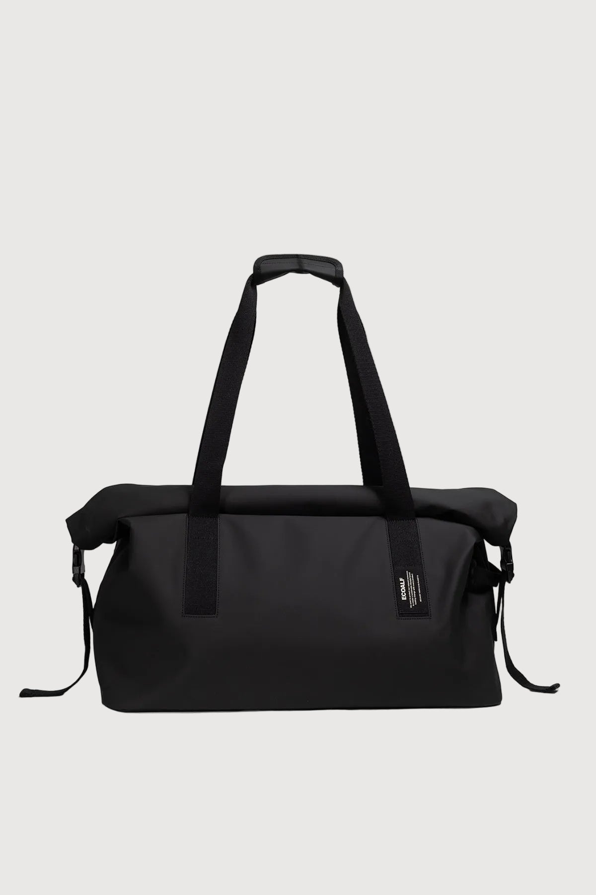 Black duffel bag with straps on a white background