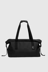 Black duffel bag with straps on a white background