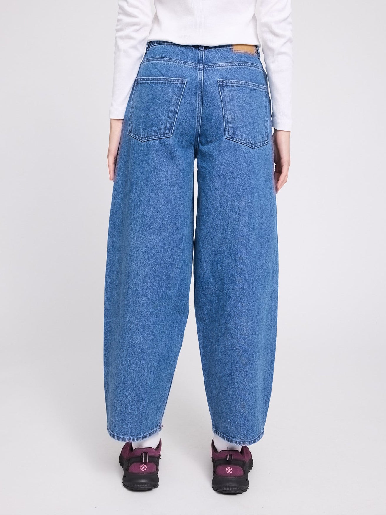Mid-blue women's barrel-leg denim jeans by MAZINE, featuring a relaxed fit and classic cotton fabric.