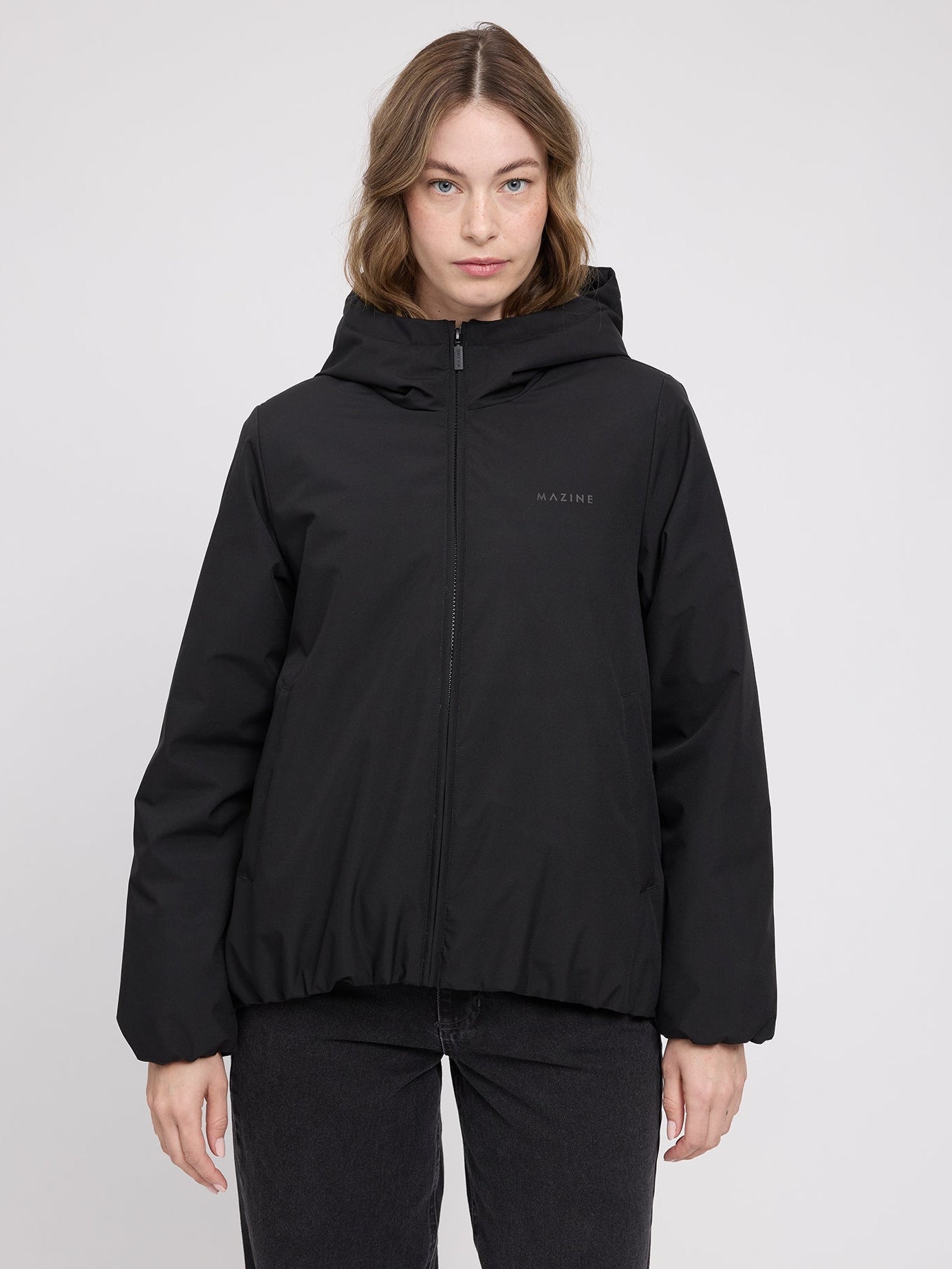 Black MAZINE women's padded jacket with a simple, sleek design, featuring a quilted texture and front zipper closure.