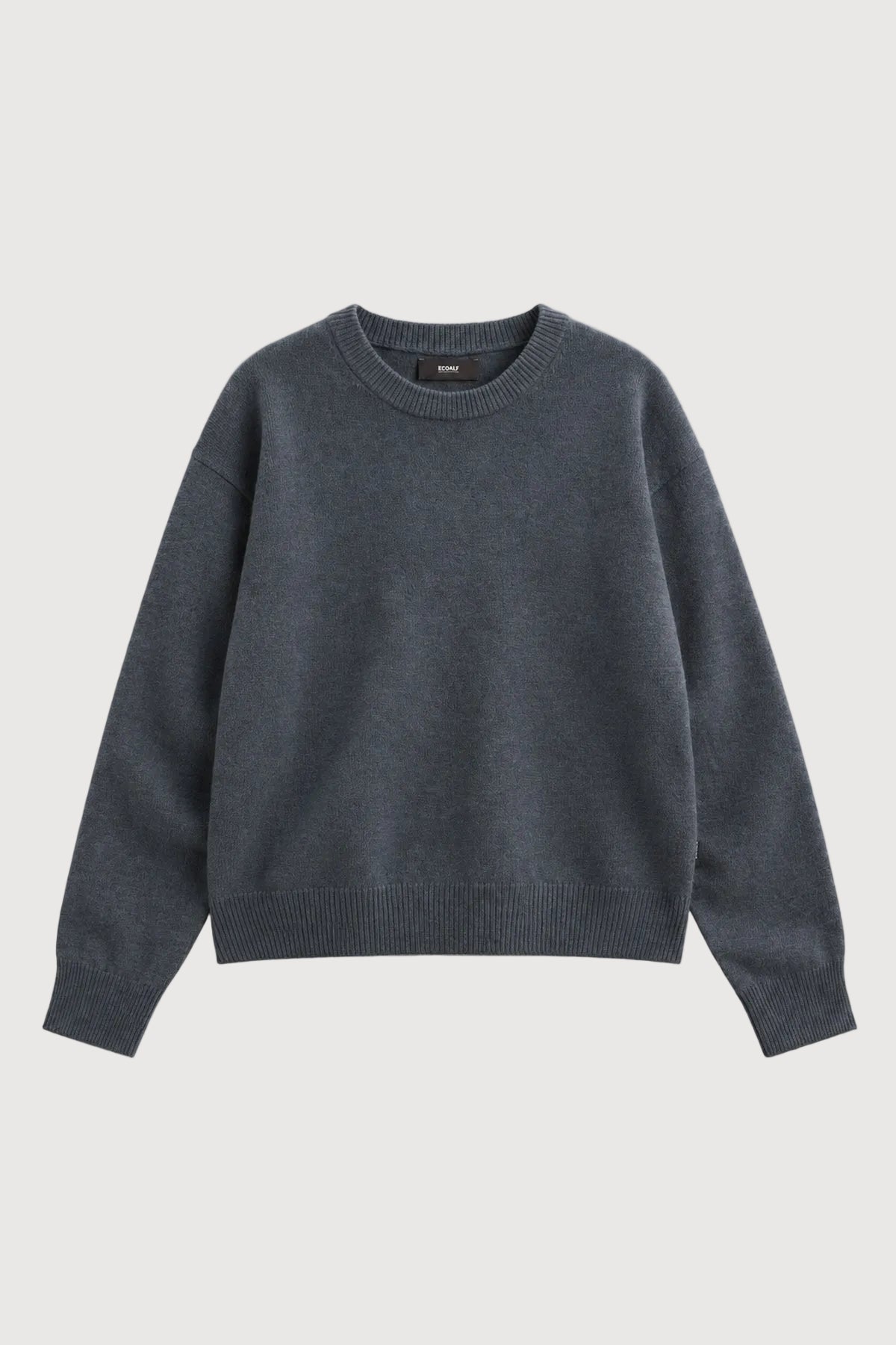 A dark gray crewneck knit sweater with long sleeves, laid flat against a light gray background.