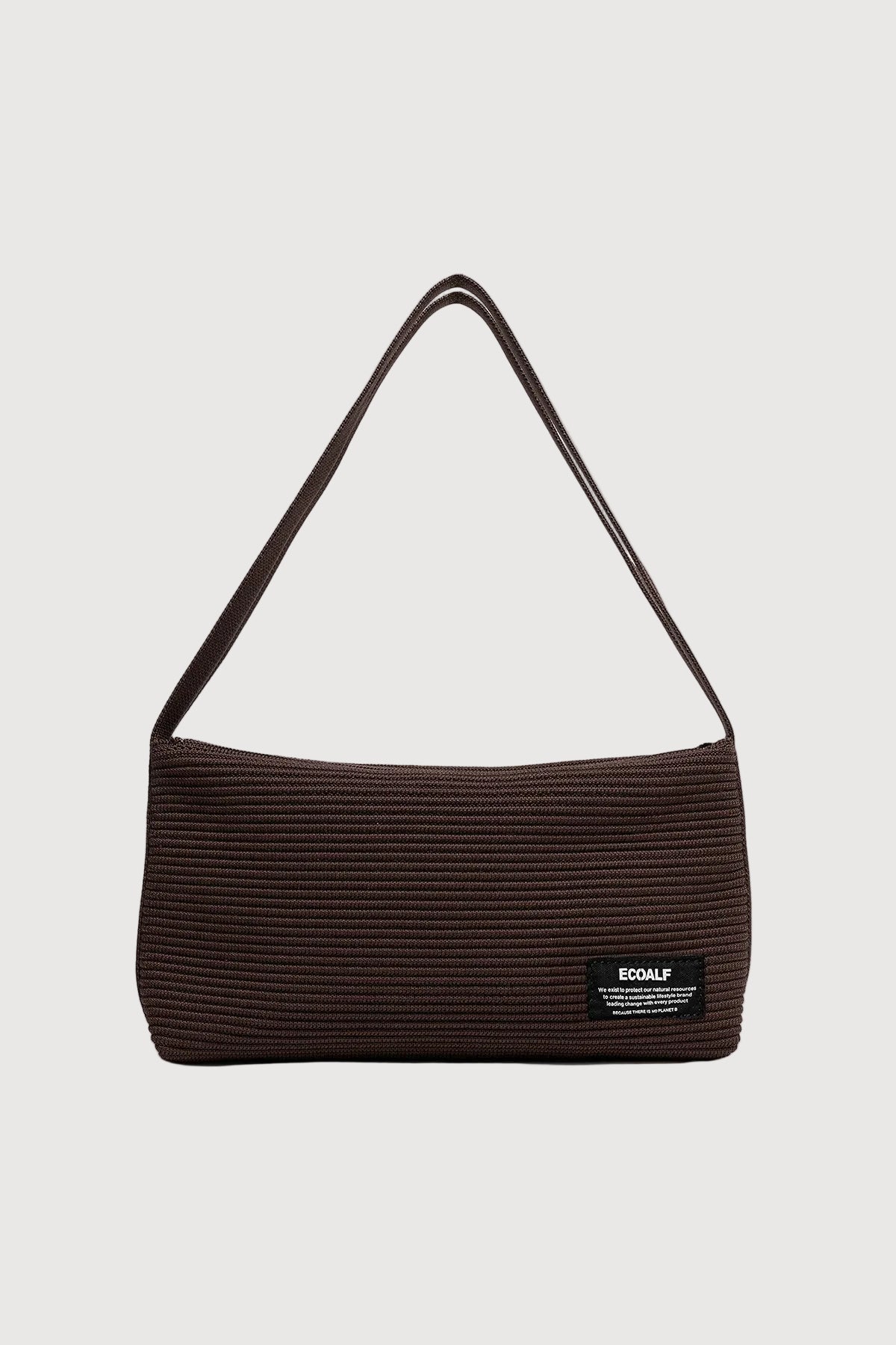 Brown textured handbag with a visible brand label on a light gray background