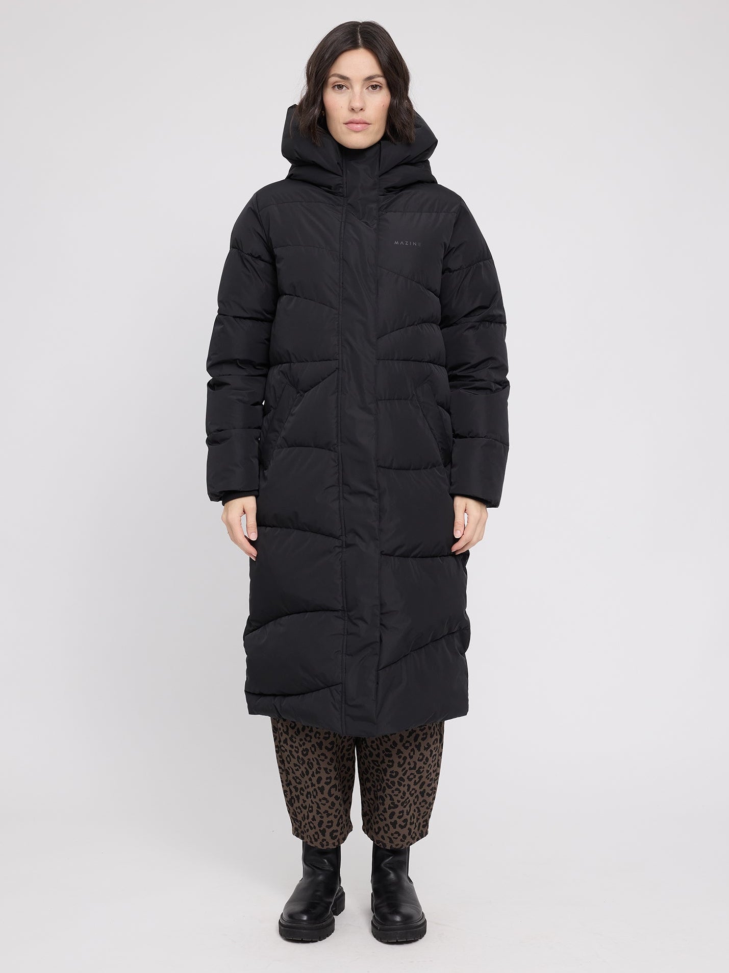 Black MAZINE coat with quilted wave pattern, stylish puffer jacket for women, featuring a cozy and modern design.